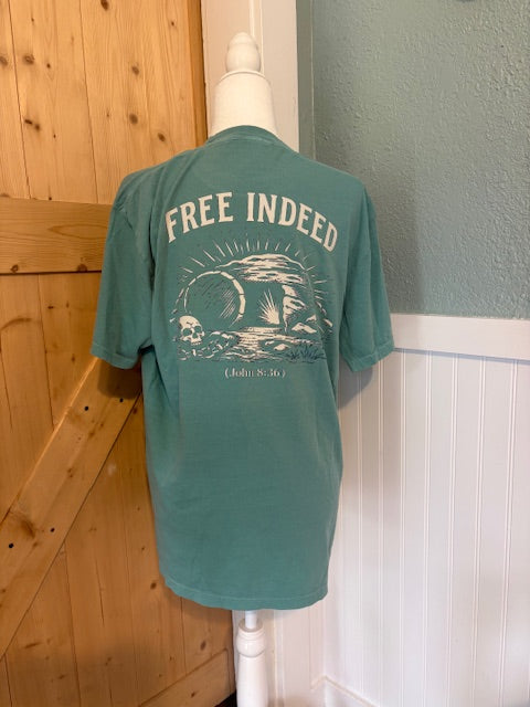 Free Indeed Graphic Tee – Teal Faith-Based Skull & Tomb Shirt